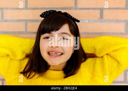 Portrait of a girl with braces on her teeth Stock Photo