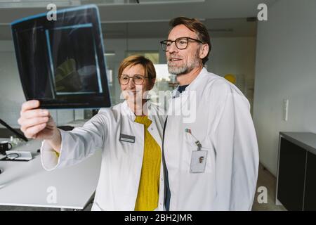Two doctors discussing x-ray image Stock Photo