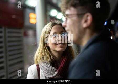 Portrait of smiling young woman looking at her boyfriend Stock Photo