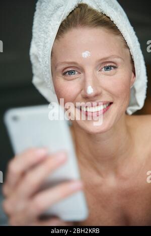 Portrait of beautiful woman with head wrapped in a towel Stock Photo ...