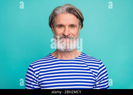 Close-up portrait of his he nice attractive well-groomed cheerful cheery content grey-haired man wearing striped jumper isolated over bright vivid Stock Photo