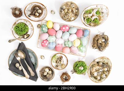 Easter flat lay. Festive table place setting decoration with colored easter eggs Stock Photo