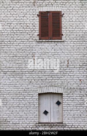 White brick wall of an old factory or workshop building Stock Photo