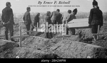 Image from the journal 'The Survey Vol, 1917. XXXVII, October 1916 - March 1917' by the Survey Associates Inc, featuring a group of men burying deceased typhus patients in Serbia, Europe. Courtesy Internet Archive. () Stock Photo