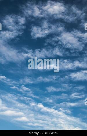 Cirrocumulus clouds at high altitude on a clean summer sky. Stock Photo