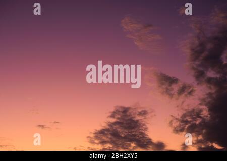 Colorful twilight summer sky with sparse, light clouds. Stock Photo
