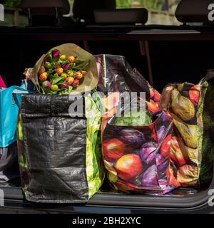 Hampshire, England, UK. 2020. Shopping bags and the weekly shop in boot of a car. Stock Photo