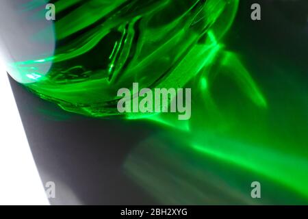 sunlight shining through green washing up liquid bottle Stock Photo