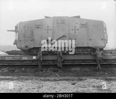 he A7V was a heavy tank introduced by Germany in 1918 during World War I. The A7V was 7.34 m (24 ft 1 in) long and 3 m (9 ft 10 in) wide, and the maximum height was 3.3 m (10 ft 10 in). The crew officially consisted of at least 17 soldiers and one officer: commander (officer, typically a lieutenant), driver, mechanic, mechanic/signaller, 12 infantrymen (six machine gunners, six loaders), and two artillerymen (main gunner and loader). A7Vs often went into action with as many as 25 men on boardTHE BRITISH ARMY ON THE WESTERN FRONT, 1914-1918 (Q 9775) Captured German A7V tank on a railway carriag Stock Photo