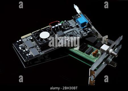 computer chip and old video card isolated on a black background Stock Photo