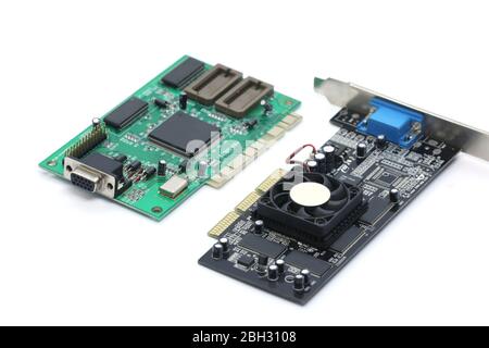 green computer chips, old video card isolated on a black background. Inside the computer. Stock Photo