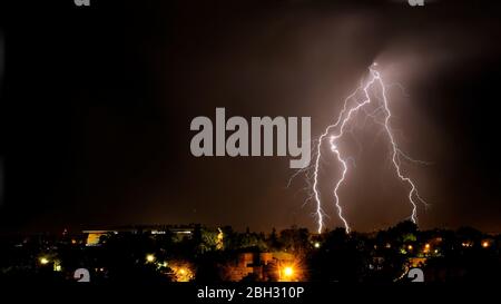 Lightning strikes at night during a severe thunderstorm over the city of Mendoza, Argentina Stock Photo