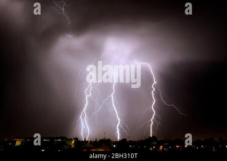 Lightning strikes at night during a severe thunderstorm over the city of Mendoza, Argentina Stock Photo