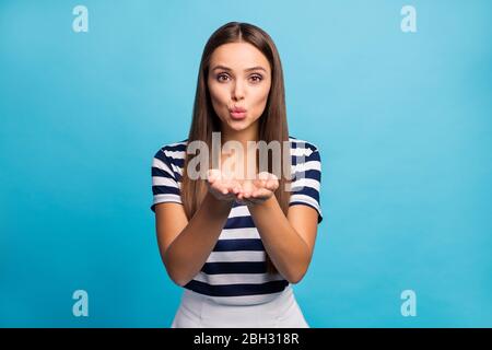 Just for you. Photo of pretty beautiful lady flirty feminine person hold hands send air kiss handsome guy dreamer wear white striped t-shirt skirt Stock Photo