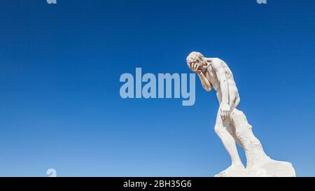 A statue of Cain after killing his brother Abel by Henri Vidal in the Tuileries Garden, Paris Stock Photo