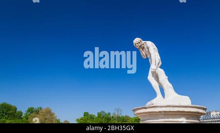 A statue of Cain after killing his brother Abel by Henri Vidal in the Tuileries Garden, Paris Stock Photo