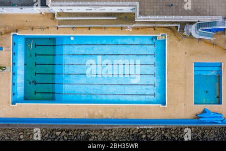 Gourock, Scotland, UK. 23 April 2020. Aerial view of Gourock outdoor swimming pool. The seawater pool would normally be busy but is now closed and water has been drained away during the coronavirus lockdown.  Iain Masterton/Alamy Live News Stock Photo