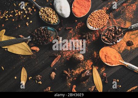Desi food spices on wooden table Stock Photo
