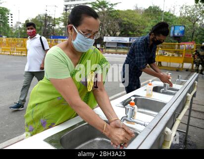 Guwahati, Assam, India. 21 April 2020. employees sanitise their hands before entering to a office to perform their duty, amid COVID-19 lockdown in Guwahati. Photo: David Talukdar Stock Photo