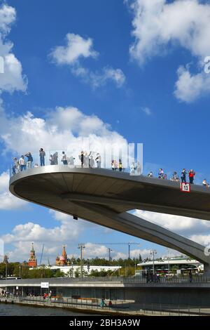 People on Floating bridge in Zaryadye park on background of blue sky Stock Photo