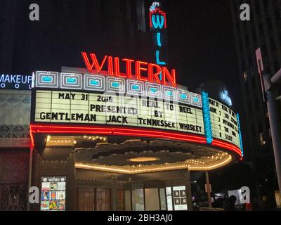 The historic Wiltern Theater marquee and neon lights in Los Angeles, CA Stock Photo