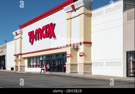 The storefront with customers entering the TJ Maxx department store in