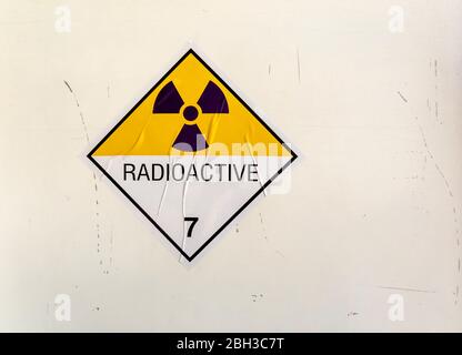 Radiation warning sign on the Hazardous materials transport label sticker Class 7 at the container of transport truck Stock Photo