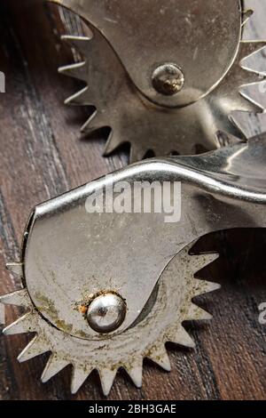 Roulette marks tailor patterns with rust and close up. Stock Photo