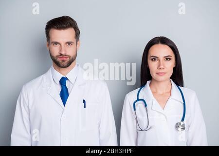 Photo of handsome doc practitioner guy professional lady two people patients consultation virology clinic listen client complaining wear white lab Stock Photo