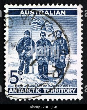 AUSTRALIA - CIRCA 1961: a stamp printed in the Australia, Australian Antarctic Territory shows Edgeworth David, Douglas Mawson and A. F. McKay, South Stock Photo