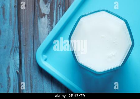 Close up of glass of fresh milk on table  Stock Photo