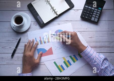 businessman analyzing financial data on paper  Stock Photo