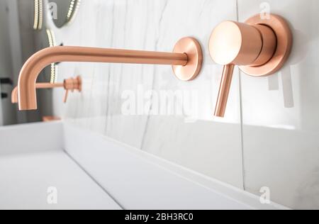 White Porcelain Sink With Copper Faucet, Knob, And Soap Dispenser. Stock Photo
