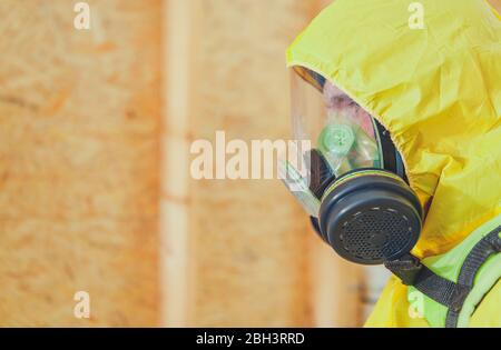 Close Up Of Man In Hazmat Suit And Mask Inside Of New Building Constrcution Stock Photo