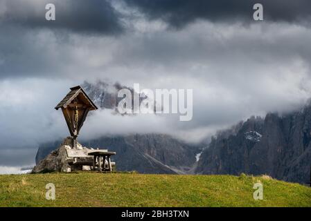 Place of worship with Jesus Christ on a holy cross at the Alpe di siusi valley dolomiti Italy Stock Photo