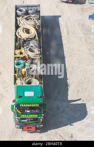 Wien, Vienna: truck at construction site with construction material, in , Wien, Austria Stock Photo