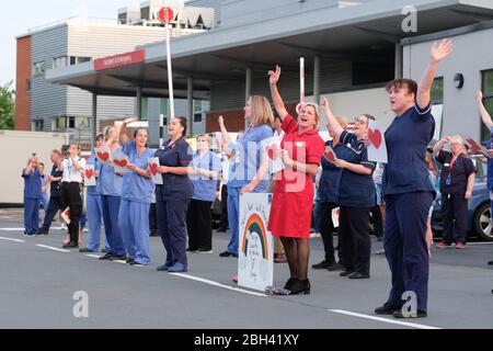 Hereford, Herefordshire, UK – Thursday 23rd April 2020 – NHS workers and staff stand outside the County Hospital in Hereford at 8pm to clap for their colleagues and other key care workers for the fifth consecutive Thursday since the Coronavirus Covid-19 lockdown started - Figures released today show that 18,738 people have died in hospital in the UK due to Covid-19. Photo Steven May / Alamy Live News Stock Photo