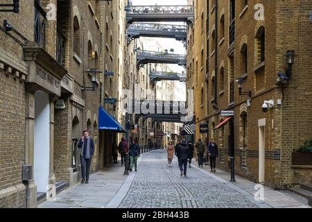 People on Shad Thames a historic cobbled riverside street with in Bermondsey, London, England United Kingdom UK Stock Photo