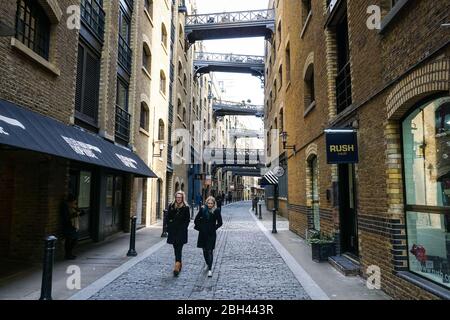 People on Shad Thames a historic cobbled riverside street with in Bermondsey, London, England United Kingdom UK Stock Photo