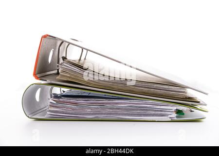 Folders filled with documents on white background. Symbol of business or bureaucracy, Stock Photo
