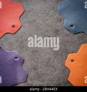 Abstract blurred background of colorful leather samples on dark leather, copy space Stock Photo