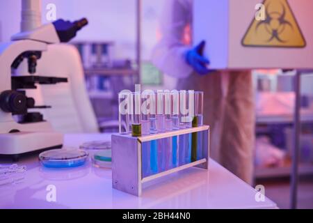 Image of test tubes with different liquid and microscope are on the table in the laboratory Stock Photo