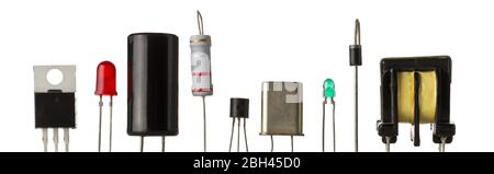 Different electronic parts or components isolated on white background with resistors, capacitors, diode, led and transistors Stock Photo