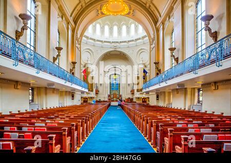 Annapolis, Maryland, USA. 9th Aug, 2019. The United States Naval Academy Chapel photographed Friday, August 9, 2019 in Annapolis, Maryland. The Chapel is one of two houses of worship on the grounds of the Navy's service academy. Protestant and Catholic services are held there. The Naval Academy Chapel is a focal point of the Academy and the city of Annapolis. The chapel is an important feature which led to the Academy being designated a National Historic Landmark in 1961. It was designed by Ernest Flagg and the cornerstone was laid in 1904 by Admiral George Dewey and the dedication of the Cha Stock Photo