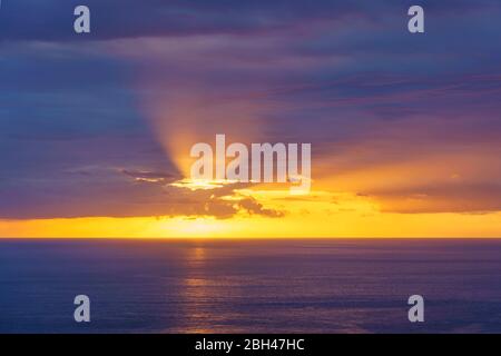 Hand of God lighting at sunset over Pacific Ocean in South Kona, Hawaii. Stock Photo
