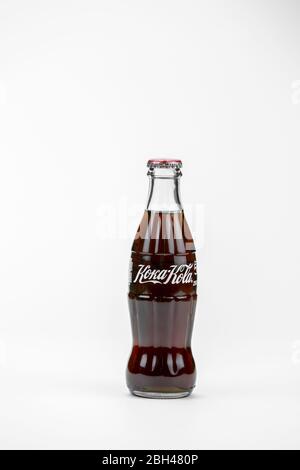 Atlanta, Georgia, USA – April 1, 2020: classic contour glass bottle of Coca Cola cyrillic label. Stock Photo