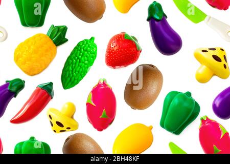 Pattern. Toy plastic fruits and vegetable collection set isolated on white background. Plastic fruit for the game. Playing at the kids store Stock Photo