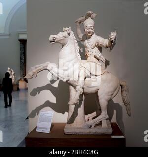 Warrior in horseback. Marble statue of the 2nd century AD. Copy of a Greek original. Archaeological Museum of Naples, Italy. Stock Photo