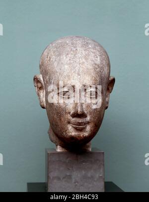 Head from a male statue, unknown origin (3rd century BC.) Ptolemaic Period, Egypt. Limestone. Carlsberg Glyptotek, Copenhagen, Denmark. Stock Photo