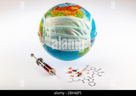 Remdesivir antiviral, thought to could cure coronavirus respiratory sickness. Remdesivir molecule and some medicines/injection syringe near the earth Stock Photo